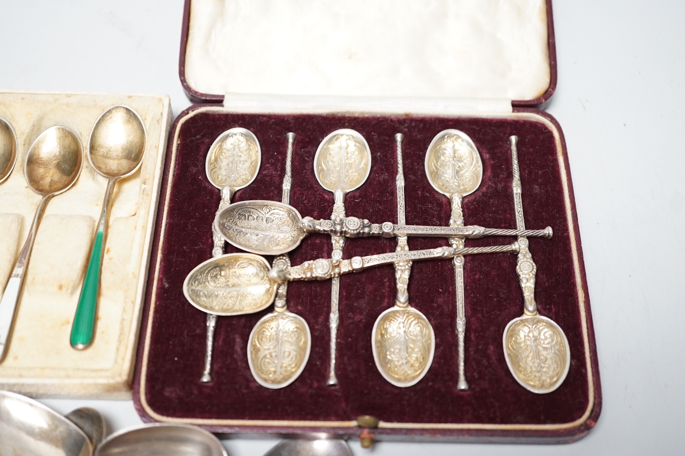 A pair of George V silver grape shears, George Howson, Sheffield, 1912, together with a small quantity of silver and white metal flatware including a set of six continental 925 and enamel coffee spoons.